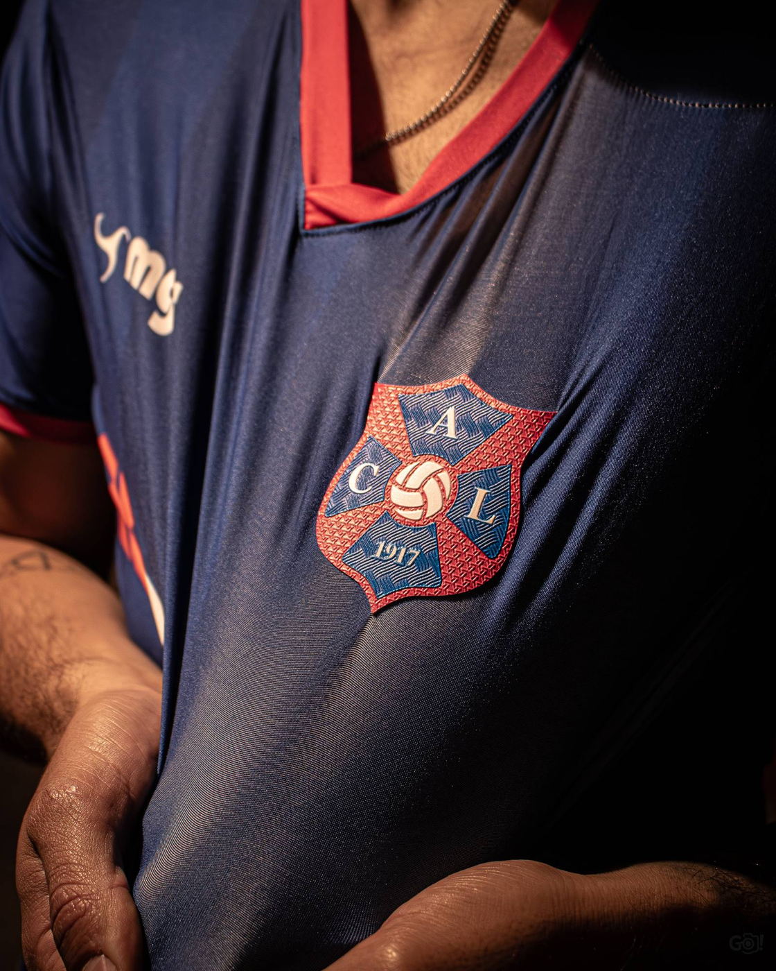 The Lito crest embroidered on the match shirt