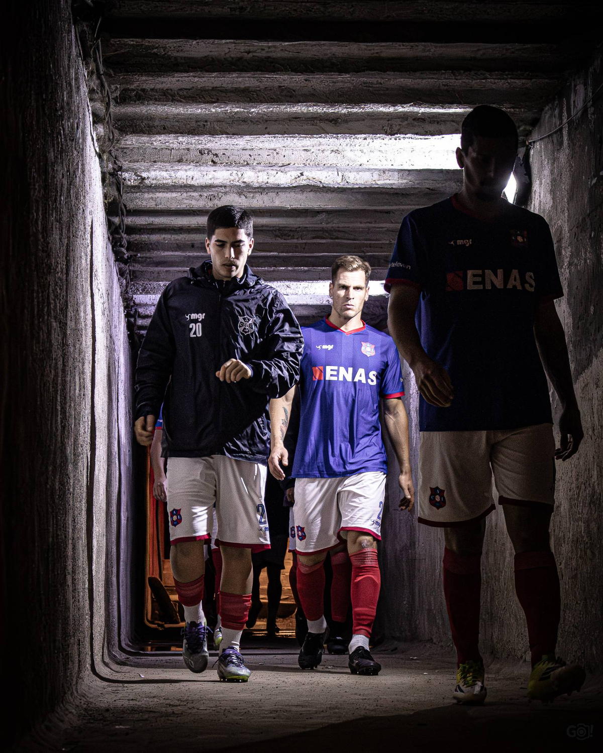 The Lito squad walks out of the tunnel towards the pitch